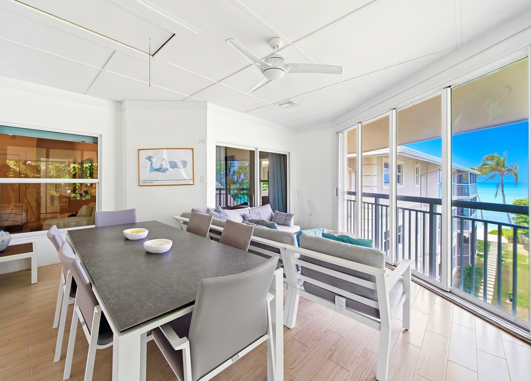 Balcony Tables Chairs Inside Outside Oceanview at The Cayman Club Condo 25 on Seven Mile Beach Grand Cayman