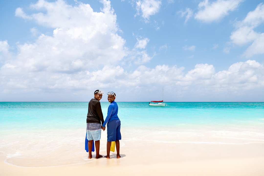 Seven Mile Beach - families enjoying pristine white sand
